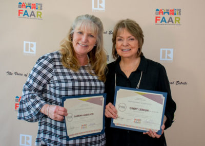 Sabrina Anderson and Cindy LeBrun proudly display Professional Honor Role achievements